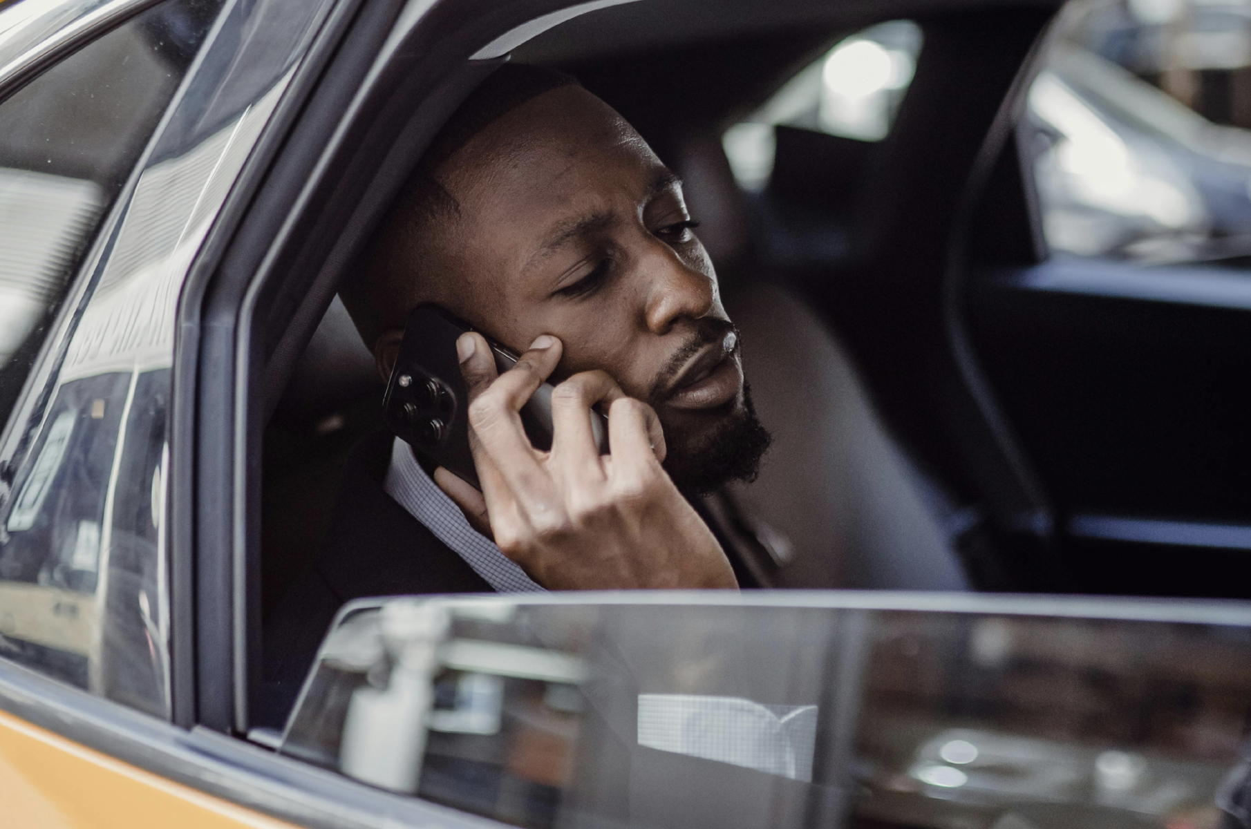 Man in taxi calling